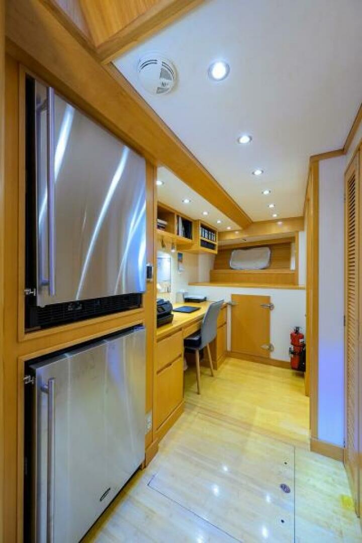 a kitchen with a large refrigerator aboard ELECTRA Yacht for Sale