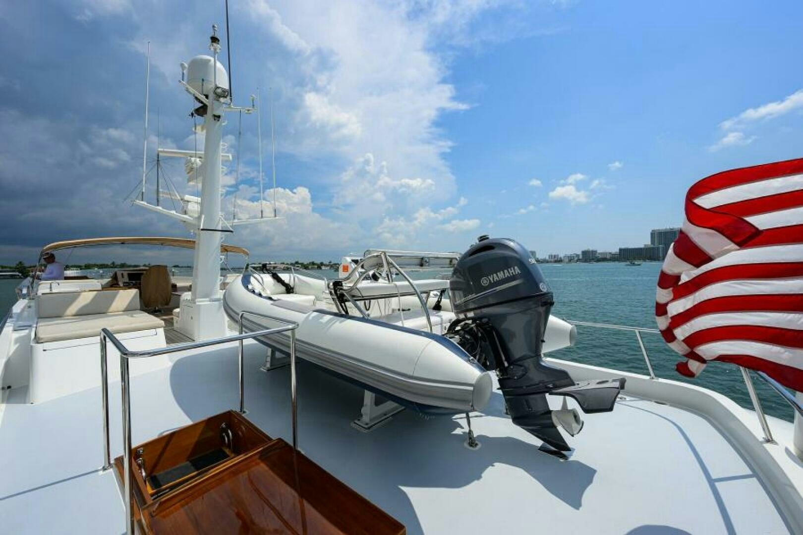 a boat with a flag on the front aboard ELECTRA Yacht for Sale