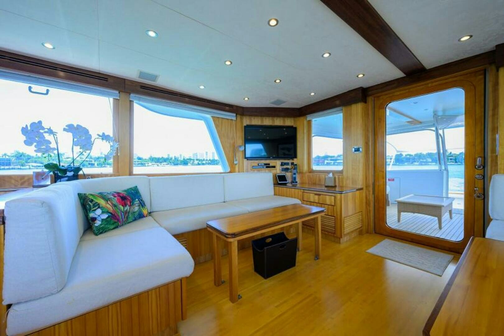 a living room with a couch and a table aboard ELECTRA Yacht for Sale