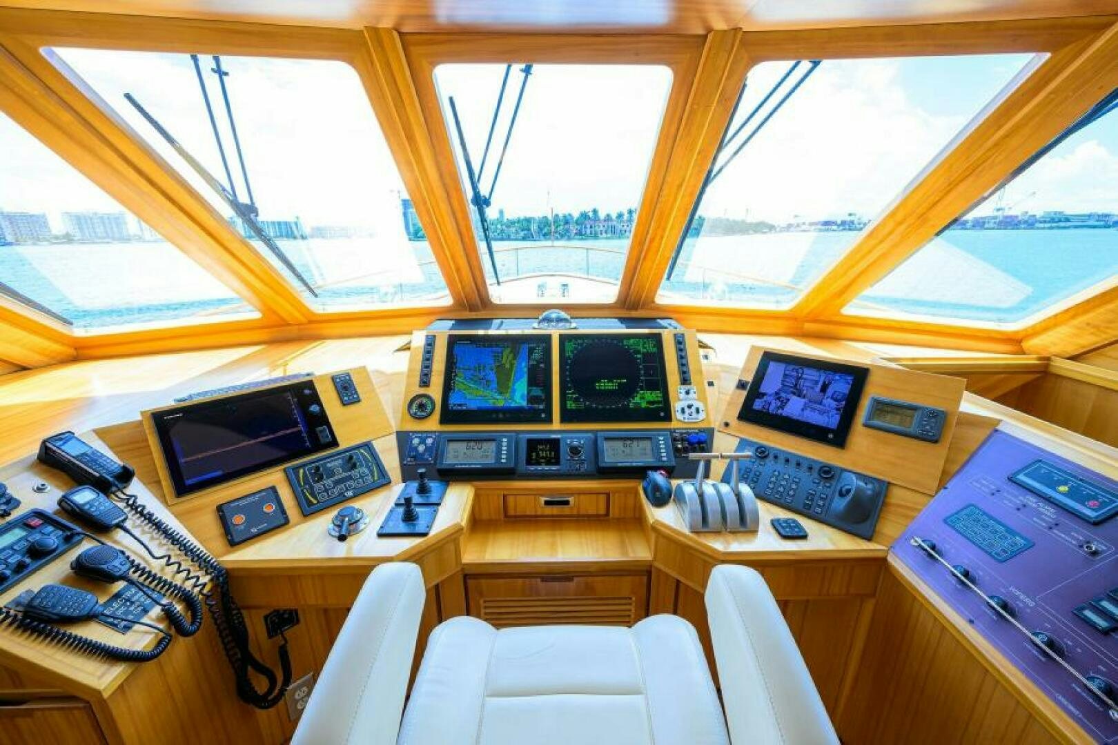 a room with computers and monitors aboard ELECTRA Yacht for Sale