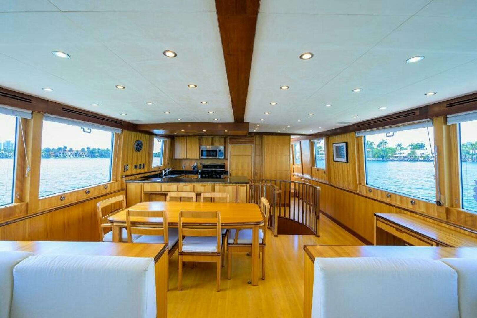 a room with tables and chairs aboard ELECTRA Yacht for Sale