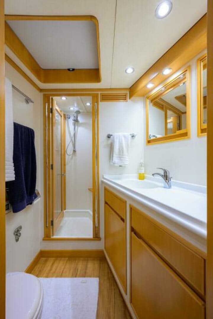 a bathroom with a shower and sink aboard ELECTRA Yacht for Sale