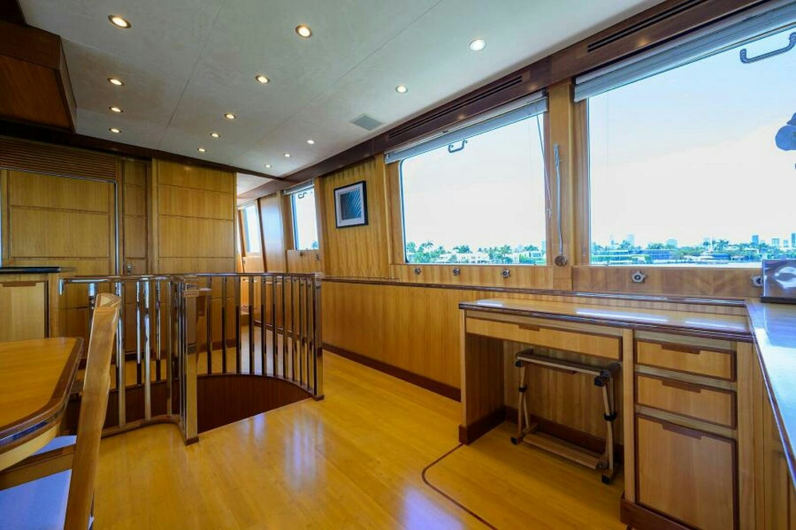 a room with tables and chairs aboard ELECTRA Yacht for Sale