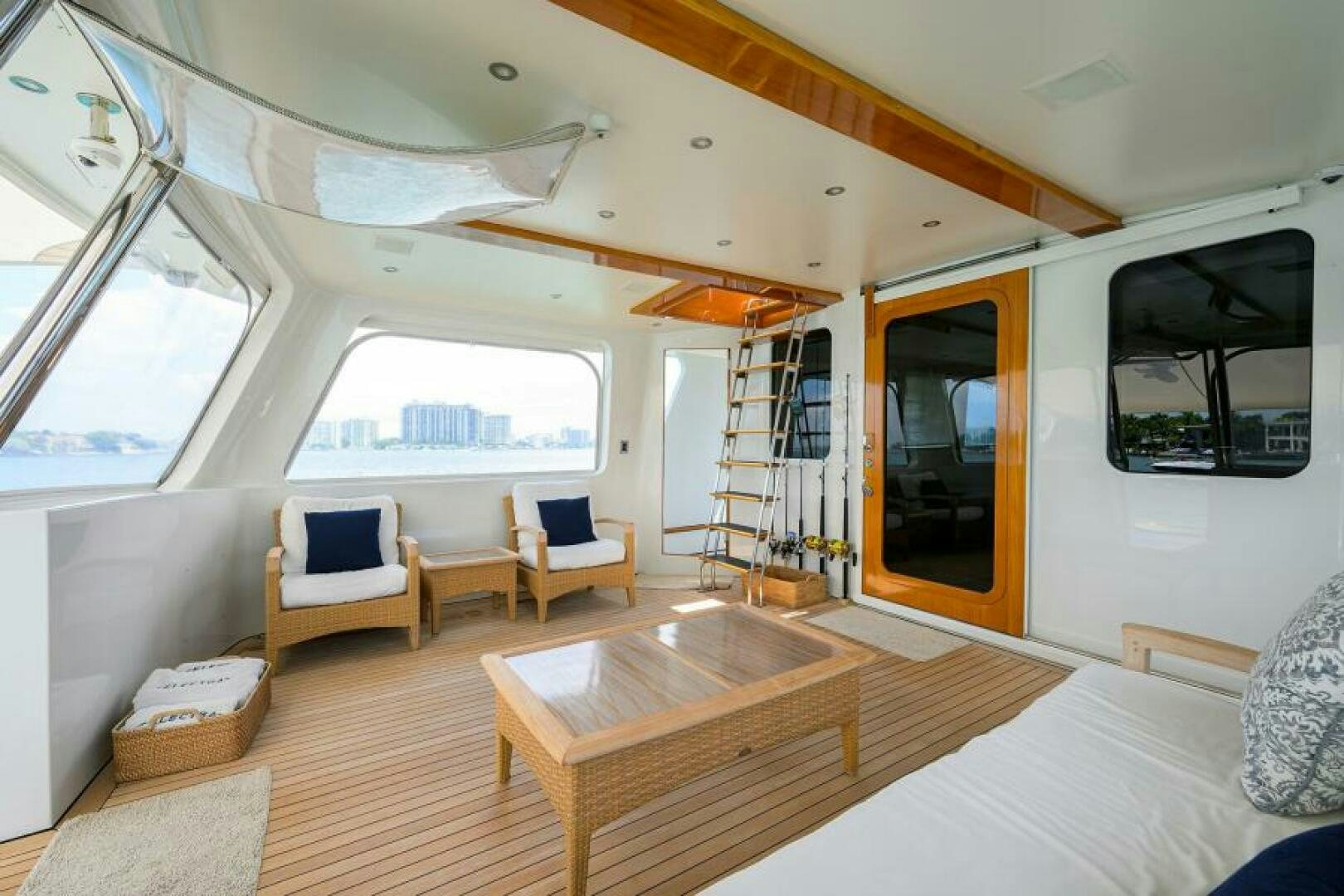 a room with a bed and a table and chairs aboard ELECTRA Yacht for Sale