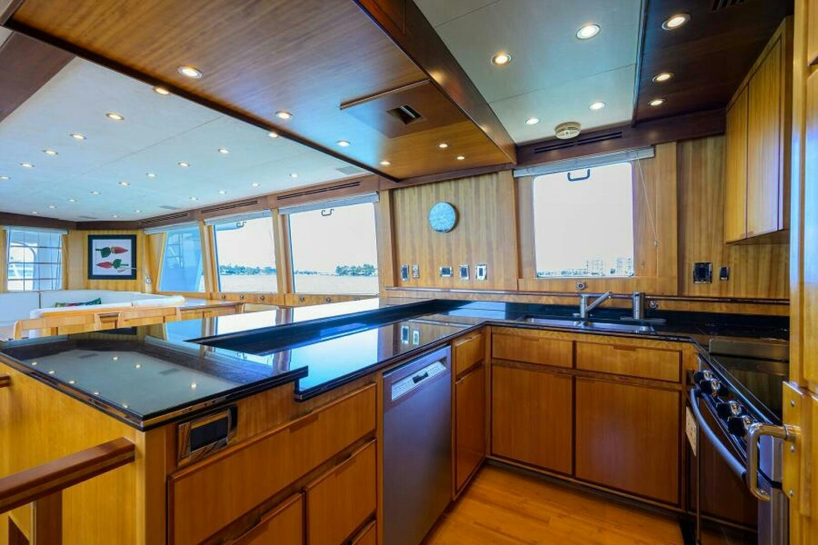 a kitchen with wooden cabinets aboard ELECTRA Yacht for Sale