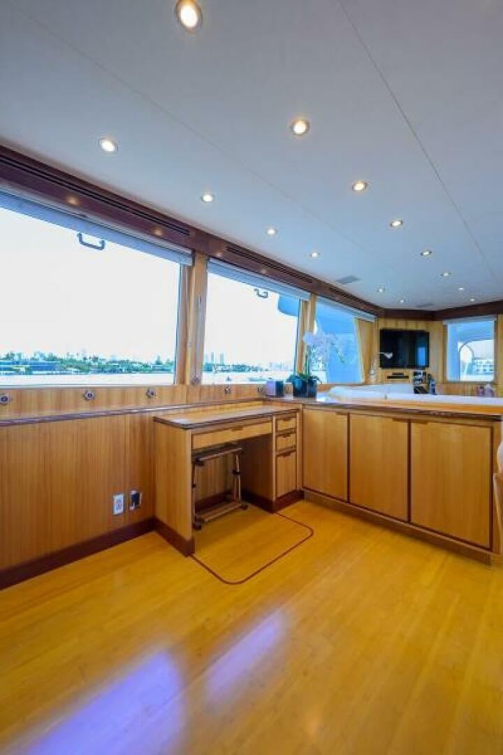 a kitchen with a wood floor aboard ELECTRA Yacht for Sale
