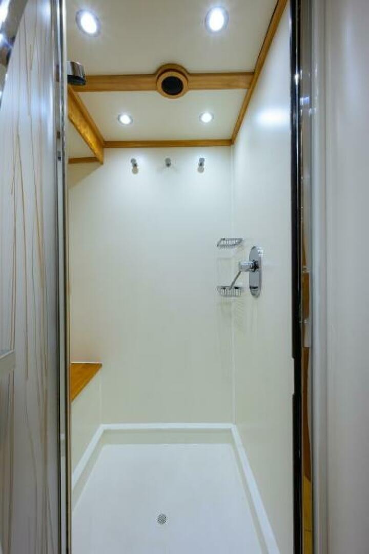 a shower with a wooden frame aboard ELECTRA Yacht for Sale