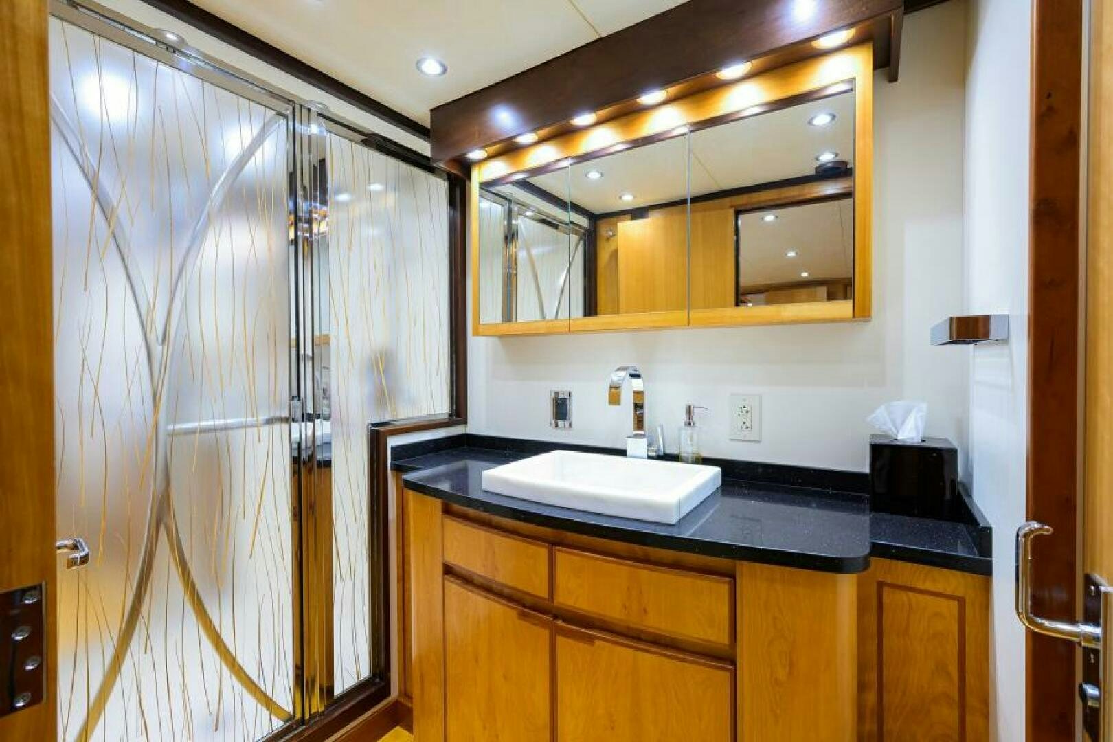 a bathroom with a sink and a mirror aboard ELECTRA Yacht for Sale