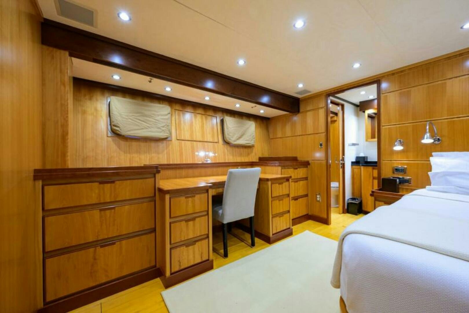 a room with a bed and a desk aboard ELECTRA Yacht for Sale