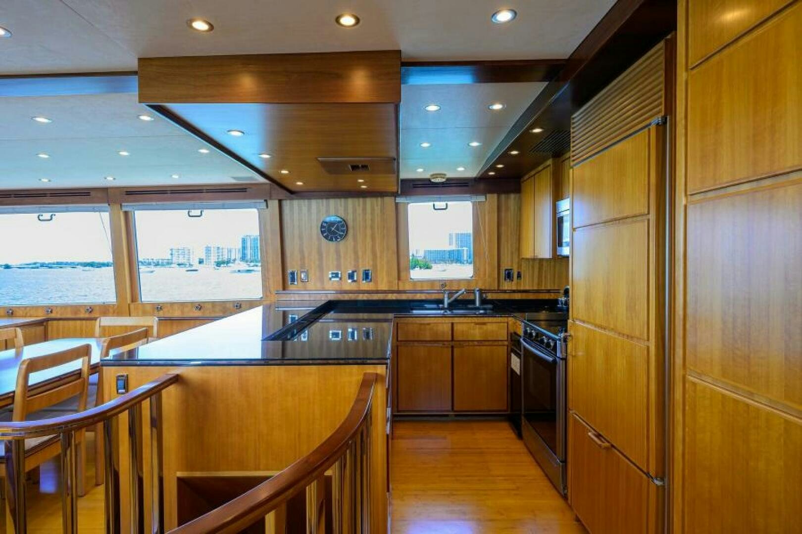 a kitchen with wooden cabinets aboard ELECTRA Yacht for Sale
