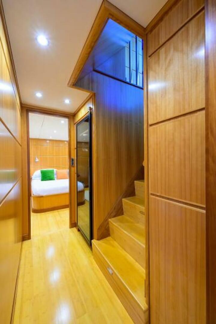 a room with a bed and a closet aboard ELECTRA Yacht for Sale