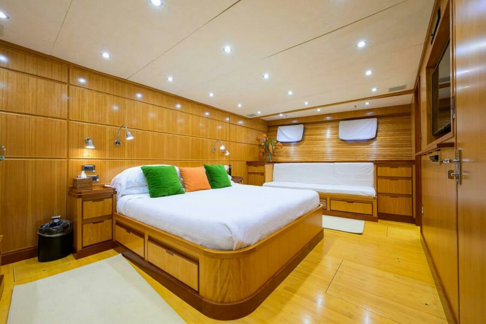 a room with a bed and a desk aboard ELECTRA Yacht for Sale