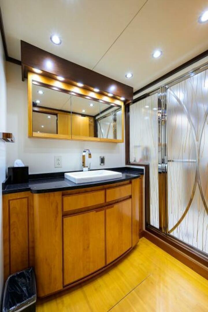a bathroom with a sink and a shower unit aboard ELECTRA Yacht for Sale