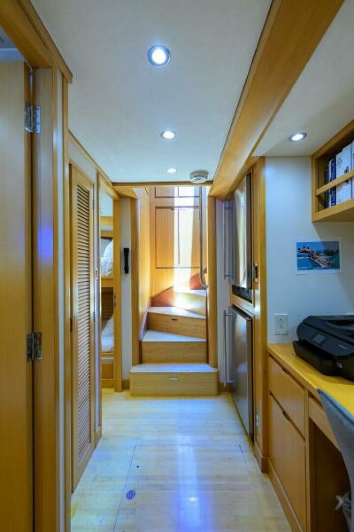 a hallway with a door and a staircase aboard ELECTRA Yacht for Sale