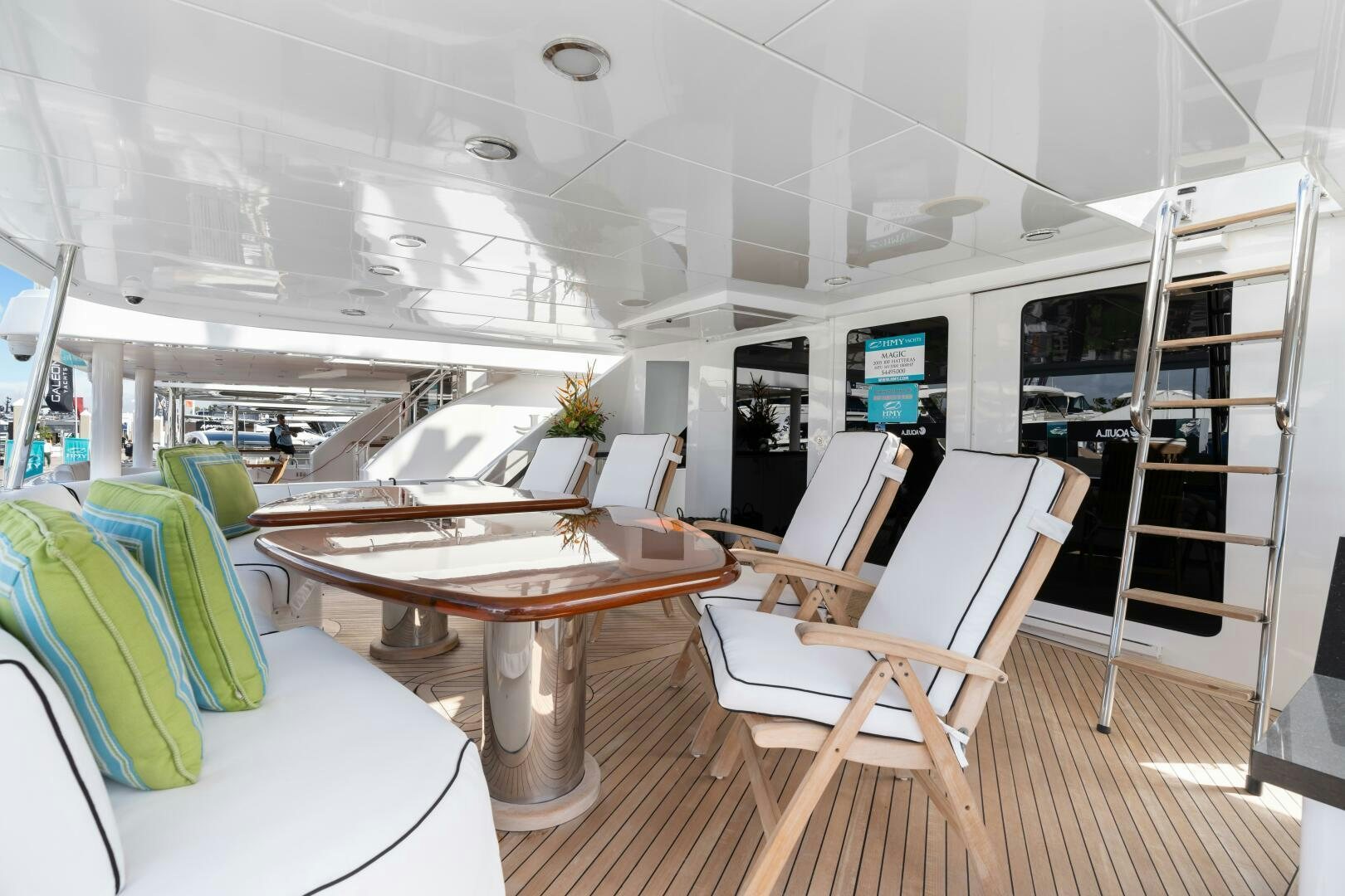 a room with a table and chairs aboard INEVITABLE Yacht for Sale
