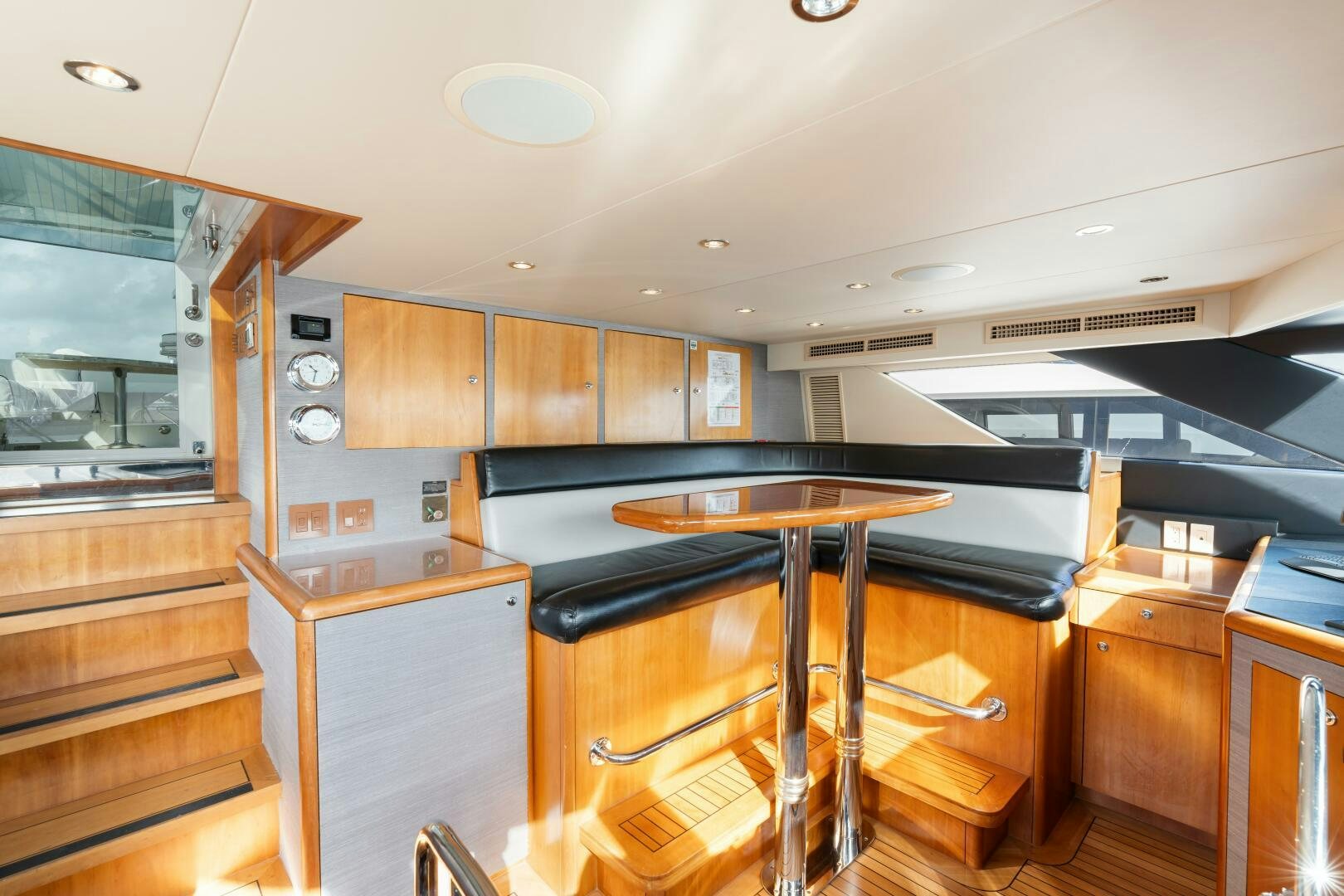 a kitchen with wooden cabinets aboard INEVITABLE Yacht for Sale