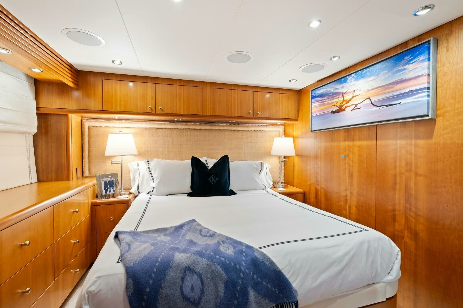 a bedroom with a bed and a desk aboard INEVITABLE Yacht for Sale