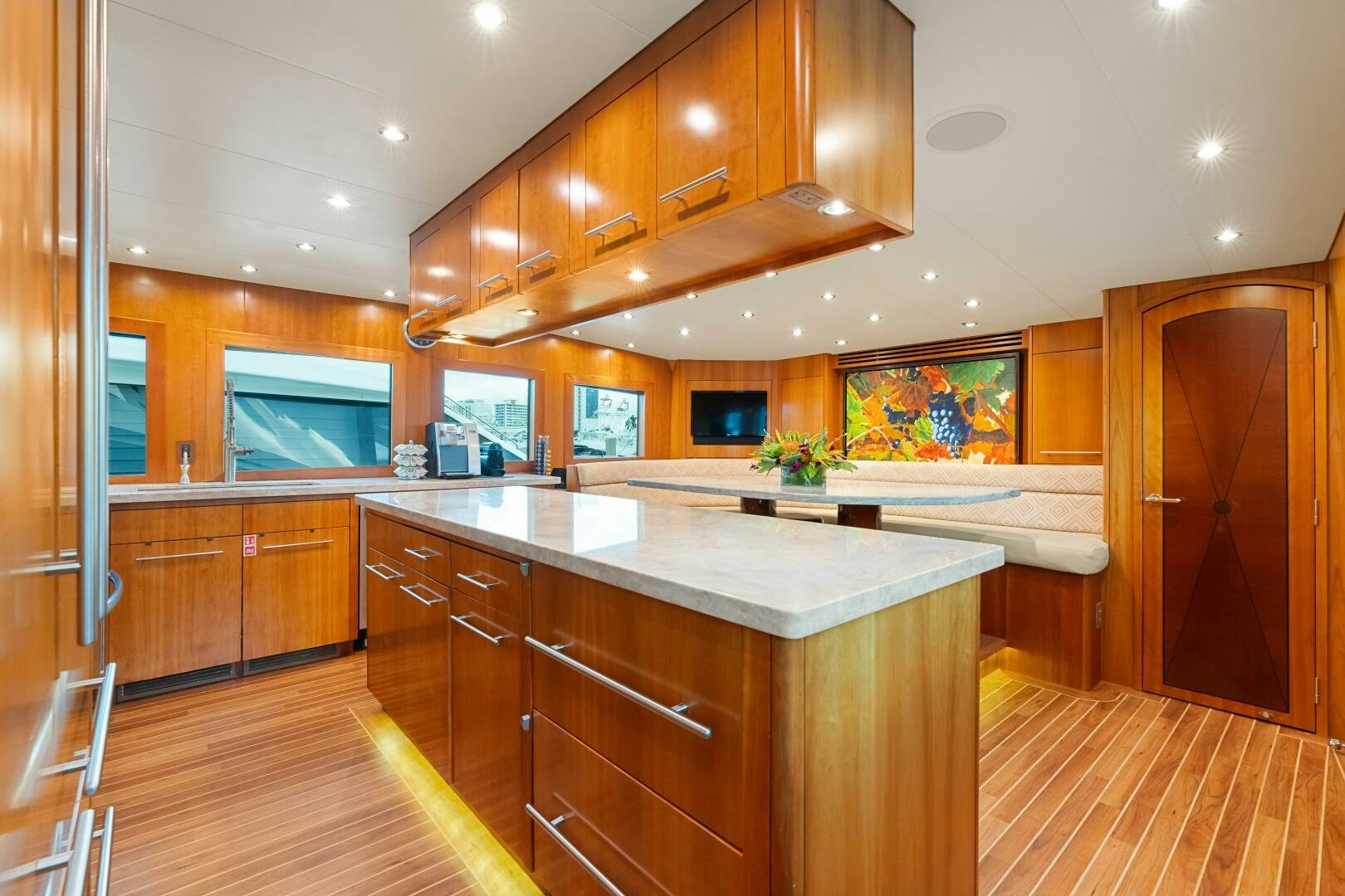 a kitchen with wooden cabinets aboard INEVITABLE Yacht for Sale