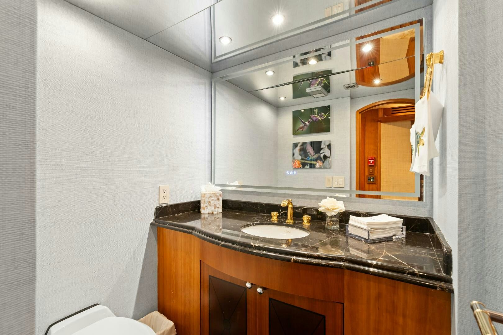 a bathroom with a sink and a mirror aboard INEVITABLE Yacht for Sale