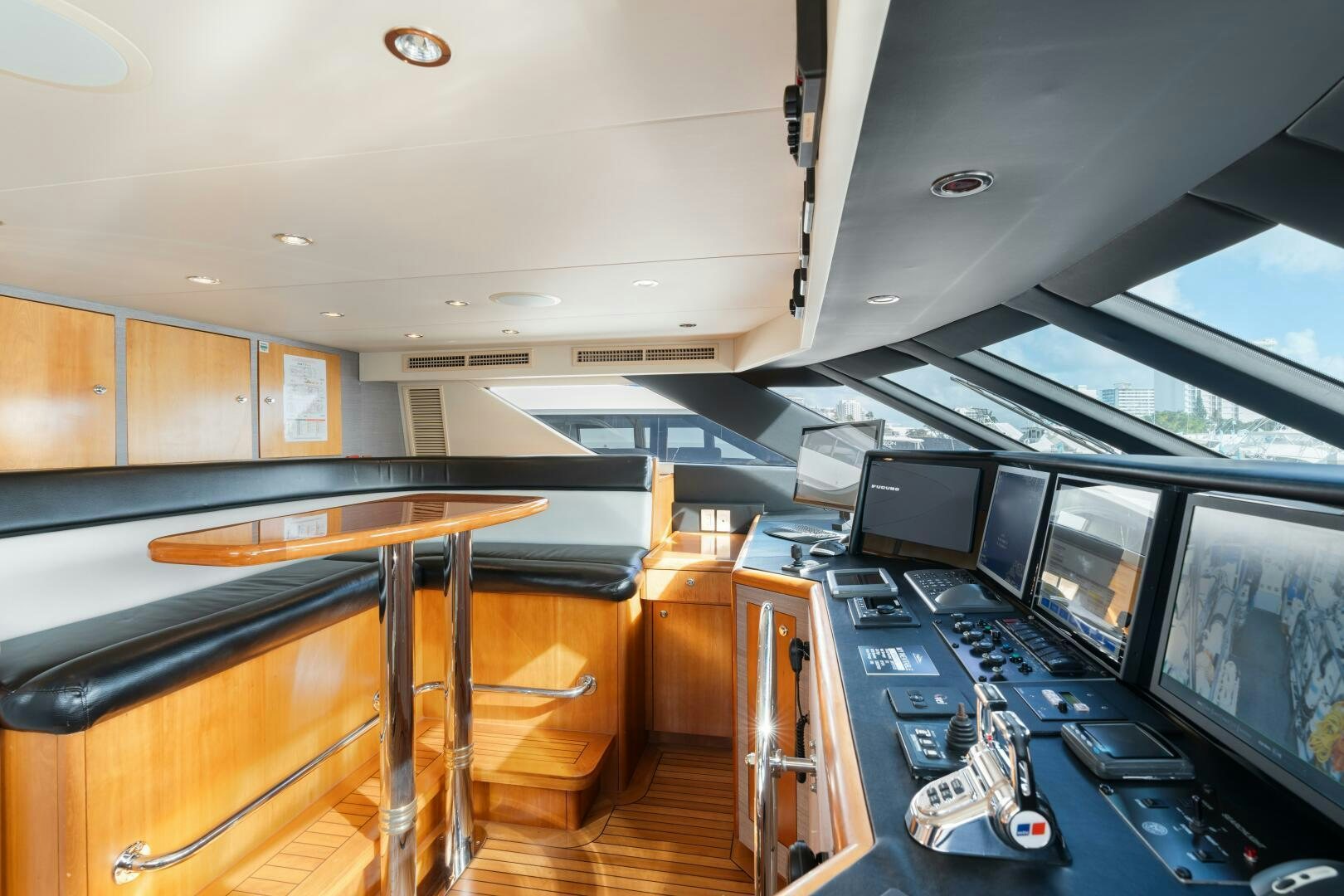 a room with computers and monitors aboard INEVITABLE Yacht for Sale