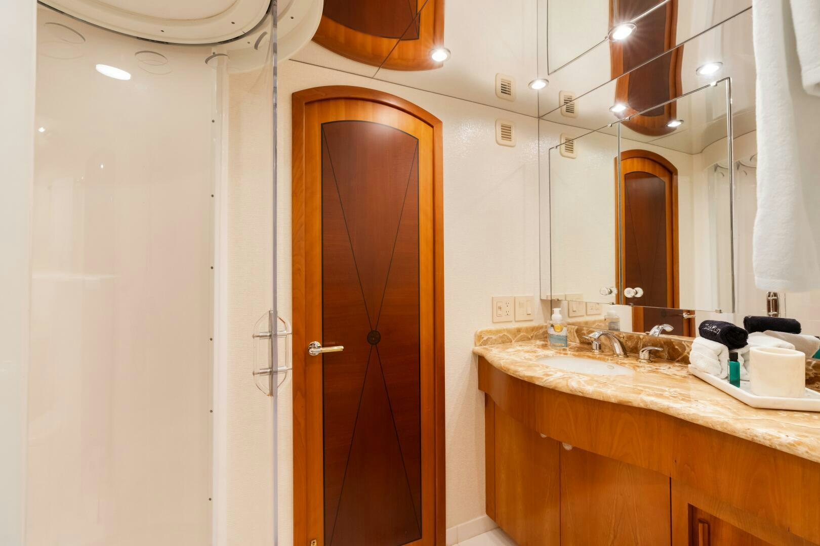 a bathroom with a sink and a mirror aboard INEVITABLE Yacht for Sale