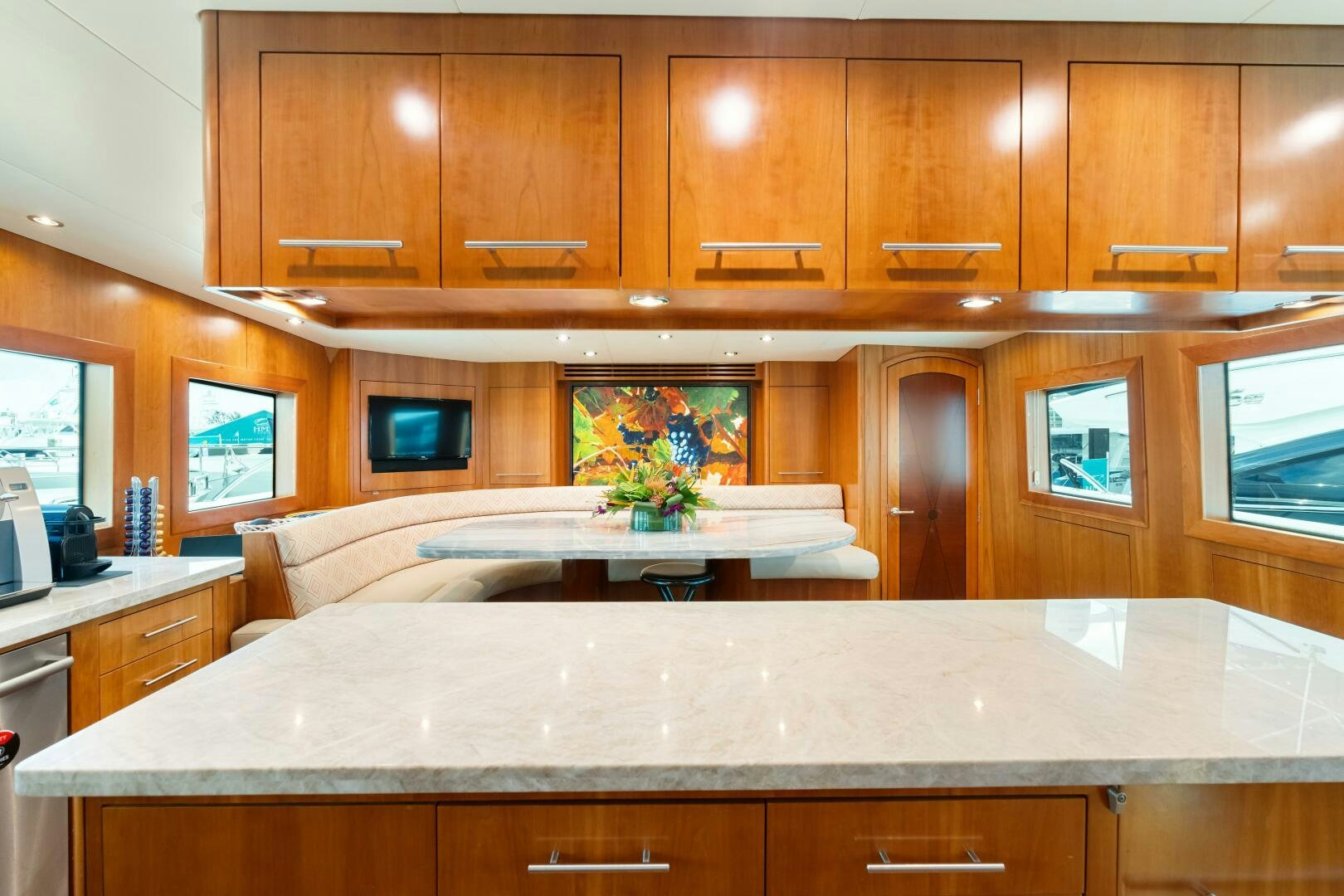 a kitchen with wooden cabinets aboard INEVITABLE Yacht for Sale