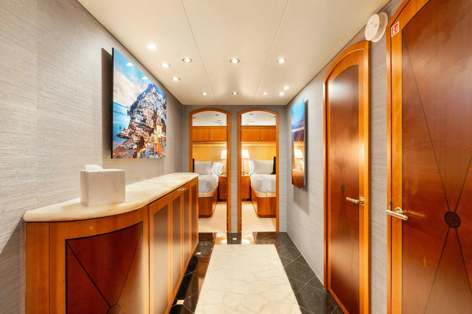 a room with a desk and a door aboard INEVITABLE Yacht for Sale
