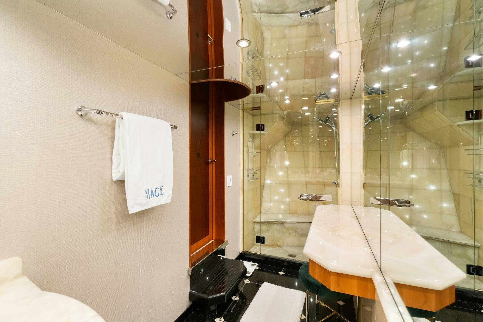 a bathroom with a large mirror aboard INEVITABLE Yacht for Sale