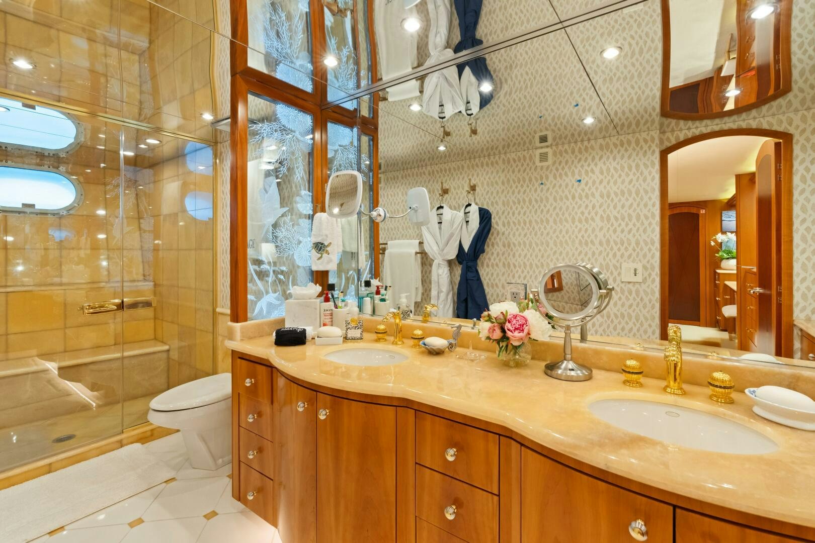 a bathroom with a large mirror aboard INEVITABLE Yacht for Sale