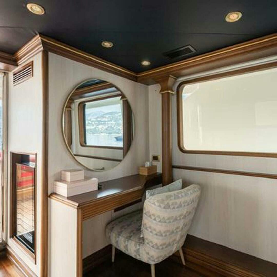 a chair in a room aboard IRAMA Yacht for Sale