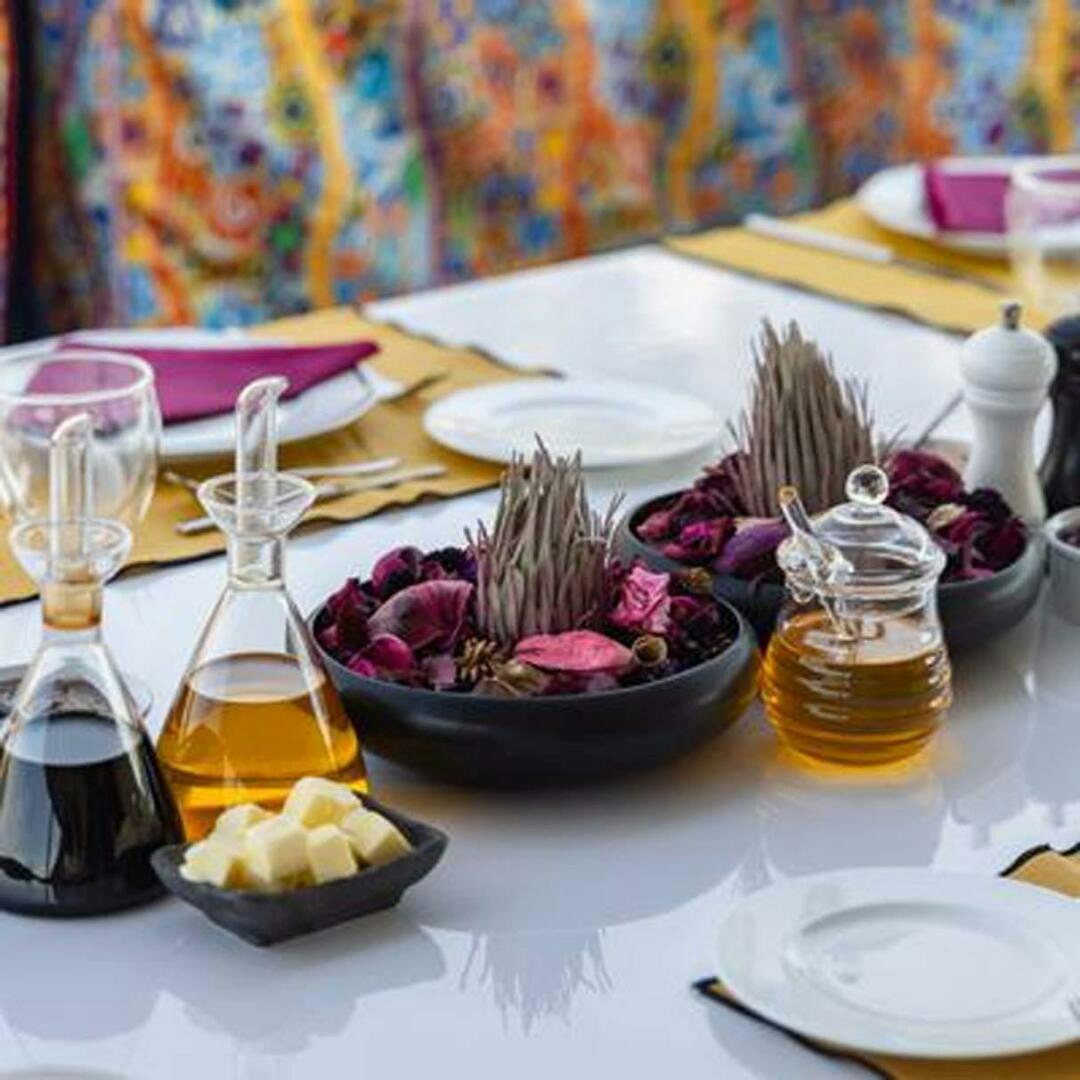 a table with food and drinks aboard IRAMA Yacht for Sale