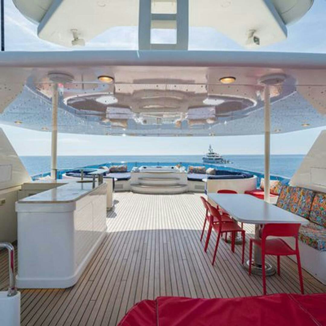 a room with a view of a ship and a deck aboard IRAMA Yacht for Sale