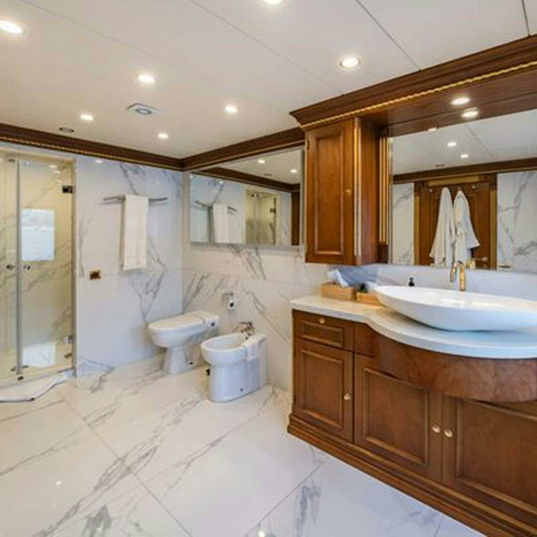 a bathroom with a large mirror aboard IRAMA Yacht for Sale