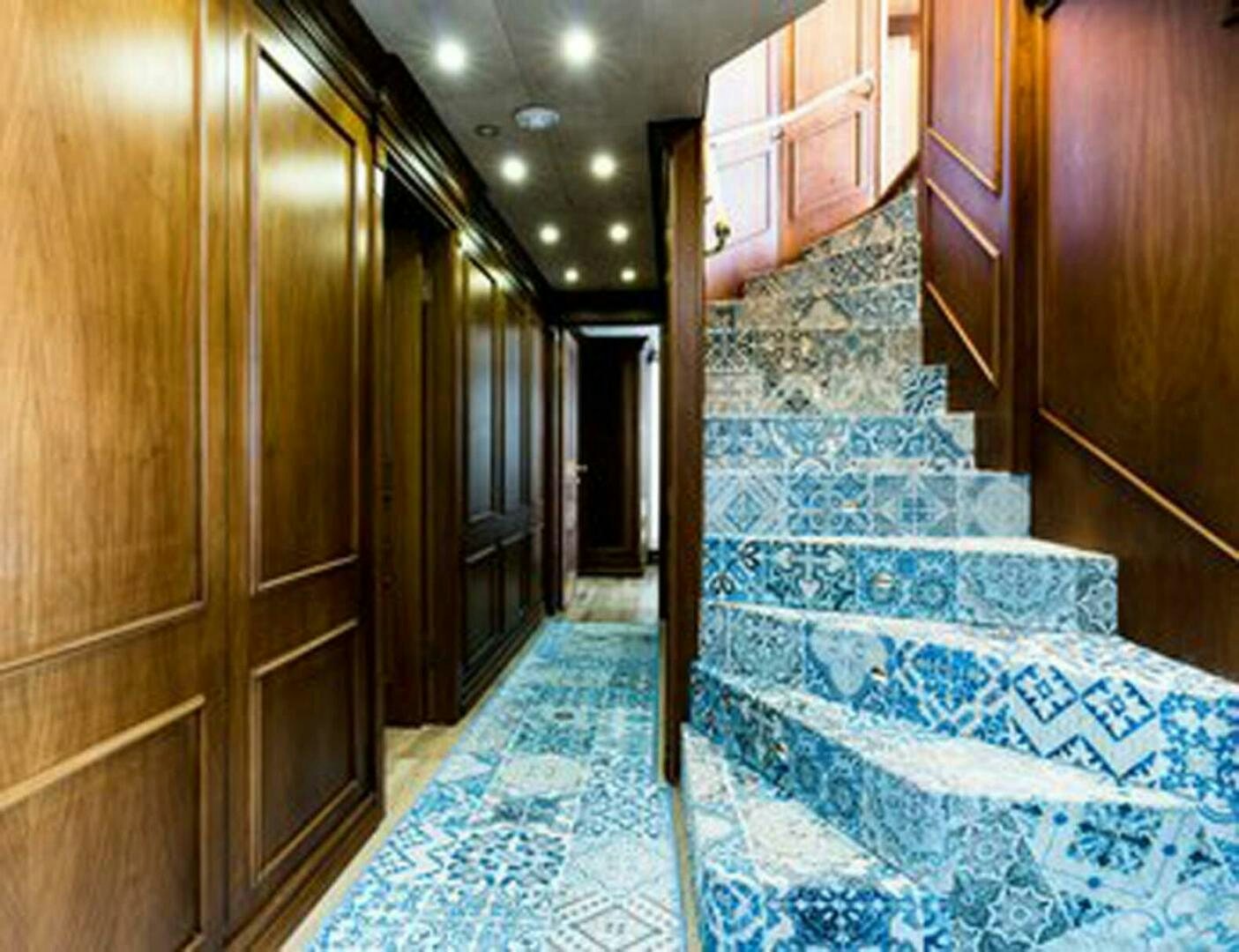 a hallway with wood cabinets aboard IRAMA Yacht for Sale