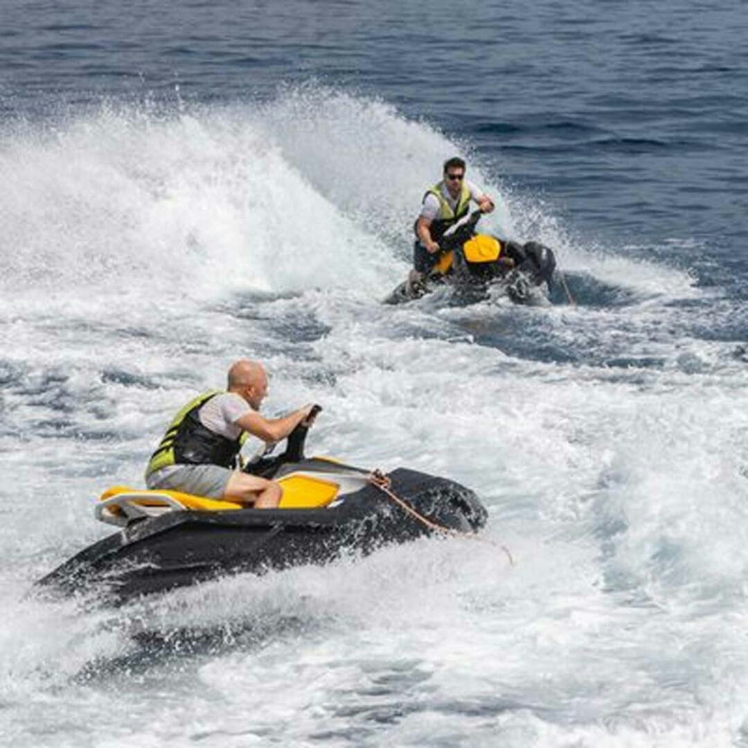 a couple of people in a kayak in the water aboard IRAMA Yacht for Sale