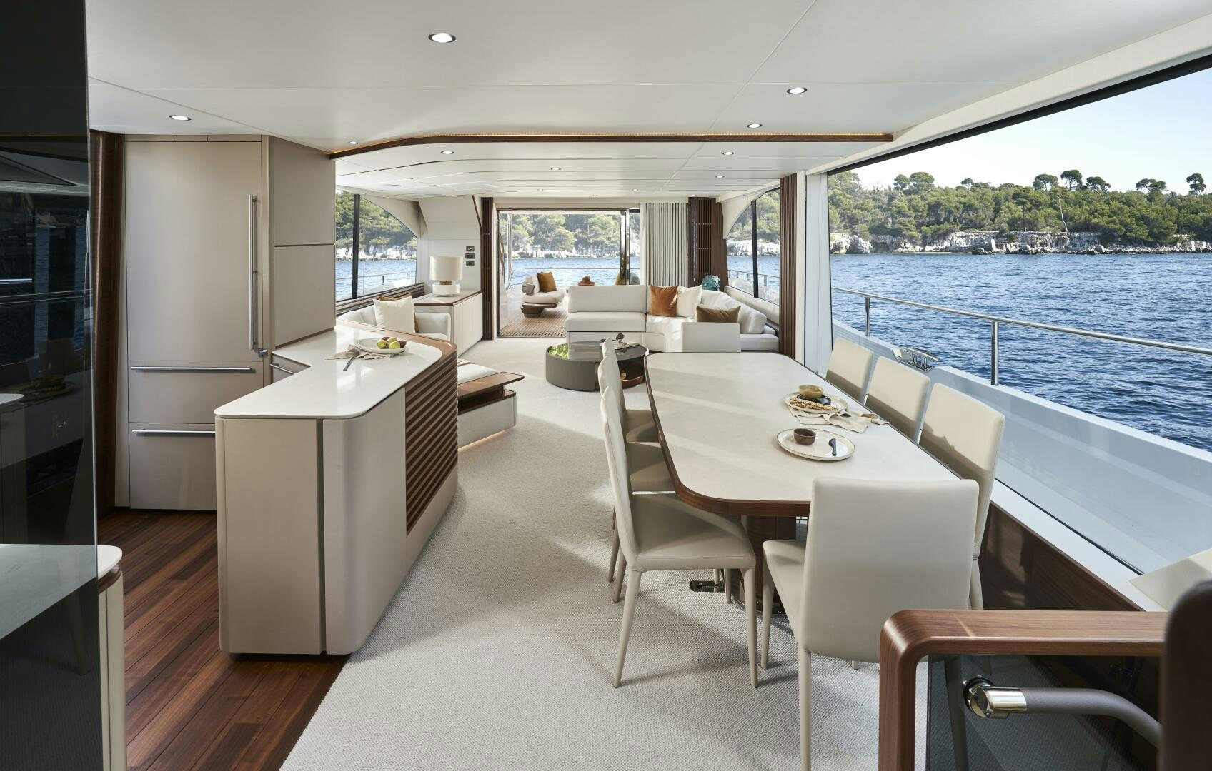 a large white kitchen with a large window overlooking a body of water aboard PRINCESS Y80 Yacht for Sale