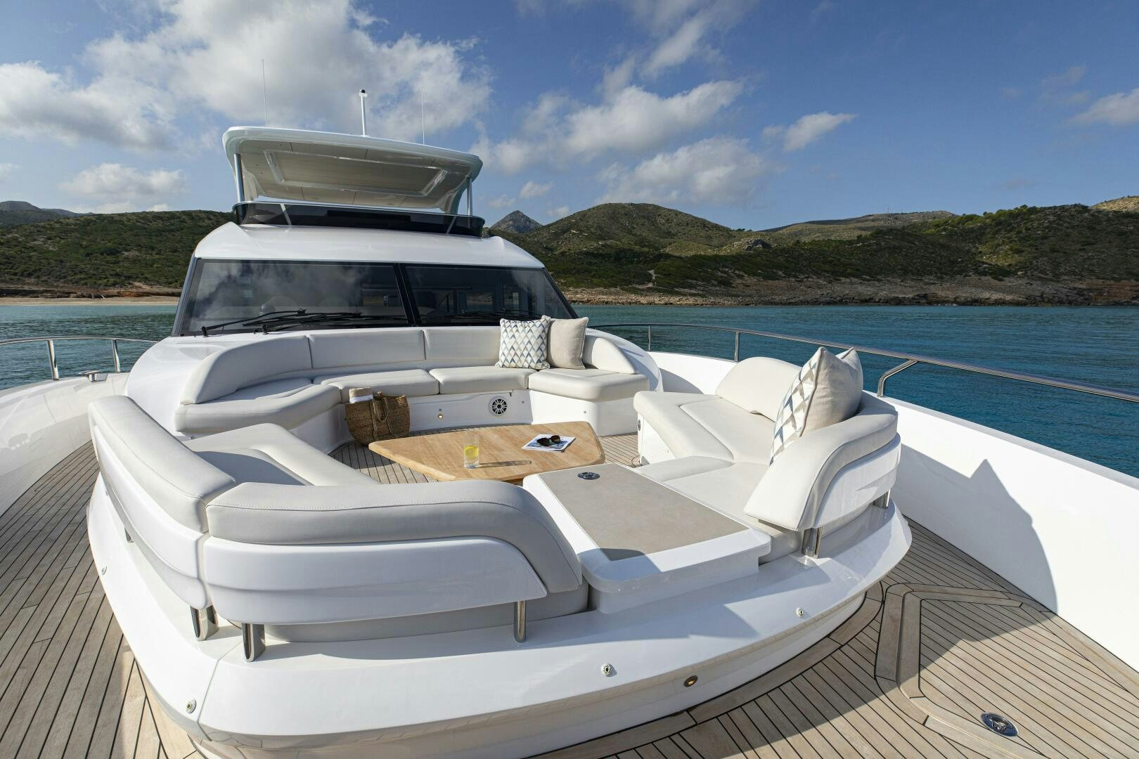 a white boat on a dock aboard PRINCESS Y80 Yacht for Sale
