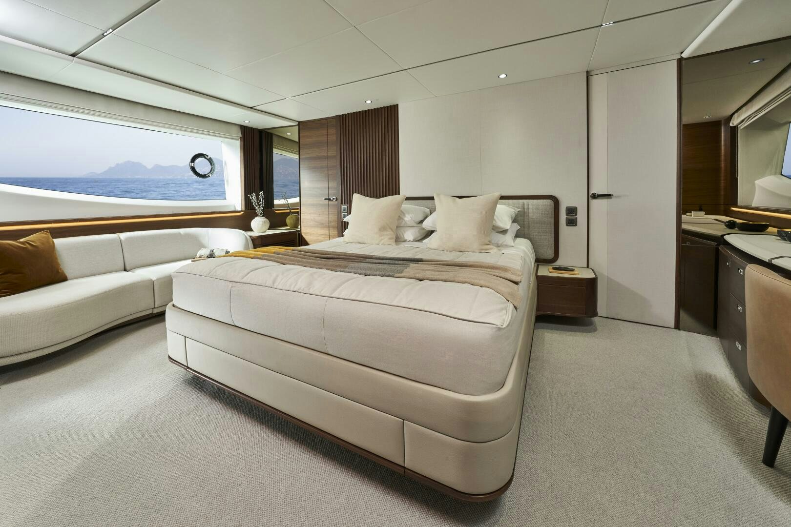 a bedroom with a bed and a couch aboard PRINCESS Y80 Yacht for Sale