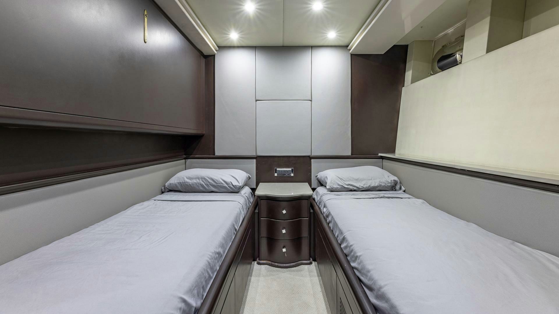 a room with two beds aboard 100 AZIMUT JUMBO Yacht for Sale