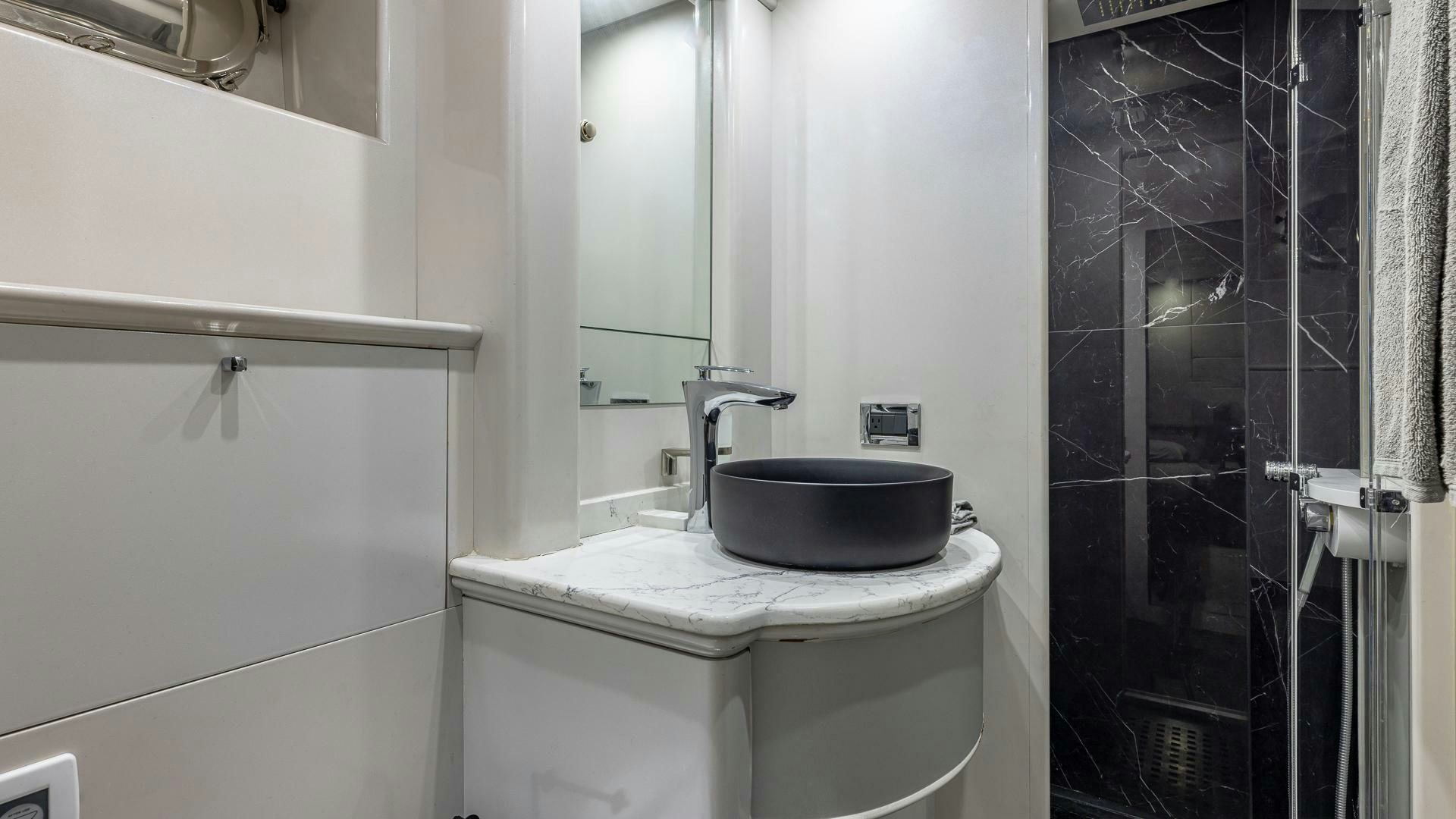 a bathroom with a toilet and sink aboard 100 AZIMUT JUMBO Yacht for Sale