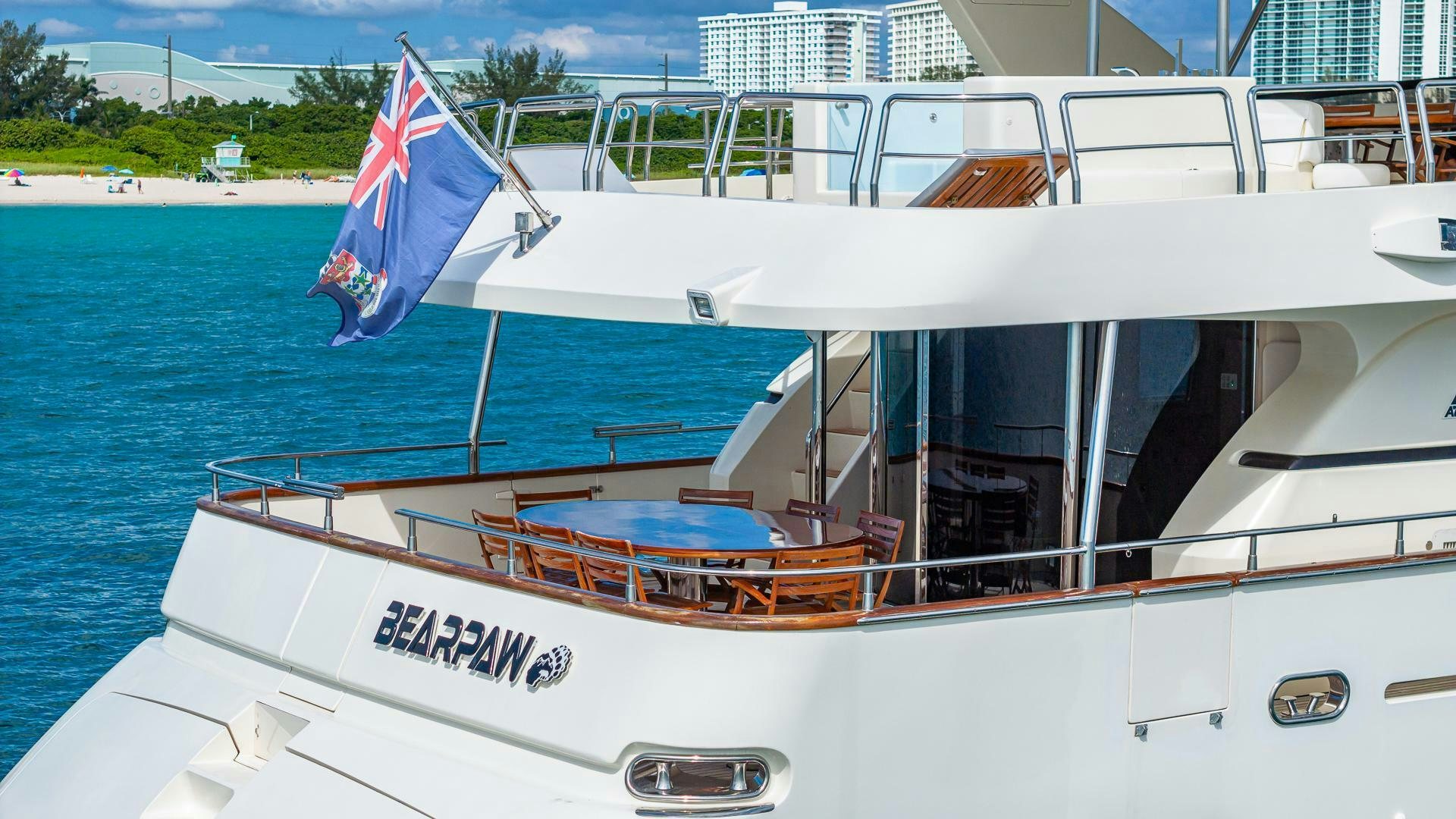 a boat with a flag on the front aboard 100 AZIMUT JUMBO Yacht for Sale