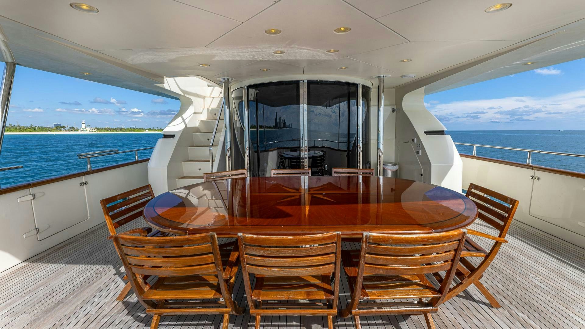a dining table on a boat aboard 100 AZIMUT JUMBO Yacht for Sale
