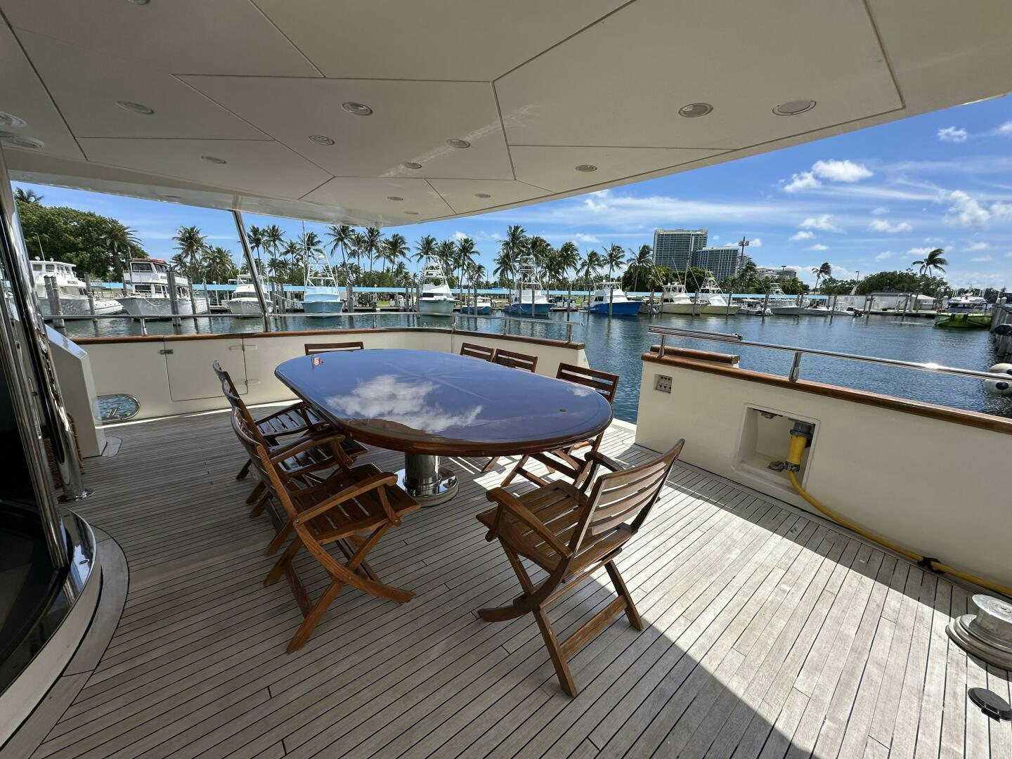 a table and chairs on a deck aboard 100 AZIMUT JUMBO Yacht for Sale