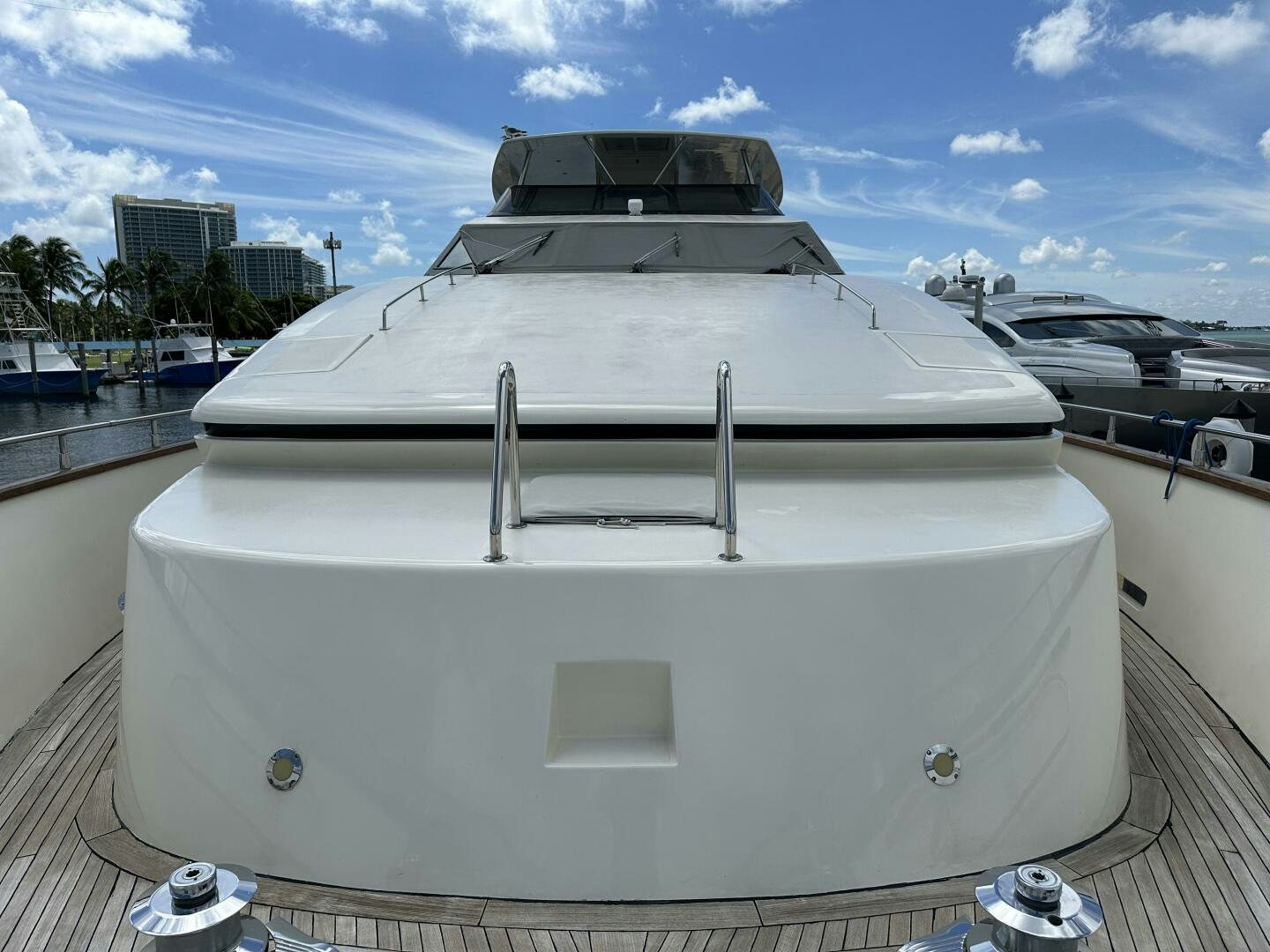 a white boat on a dock aboard 100 AZIMUT JUMBO Yacht for Sale