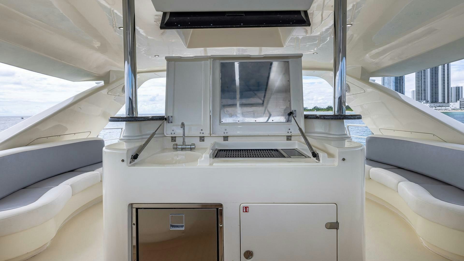a white car with a sink and a computer monitor aboard 100 AZIMUT JUMBO Yacht for Sale