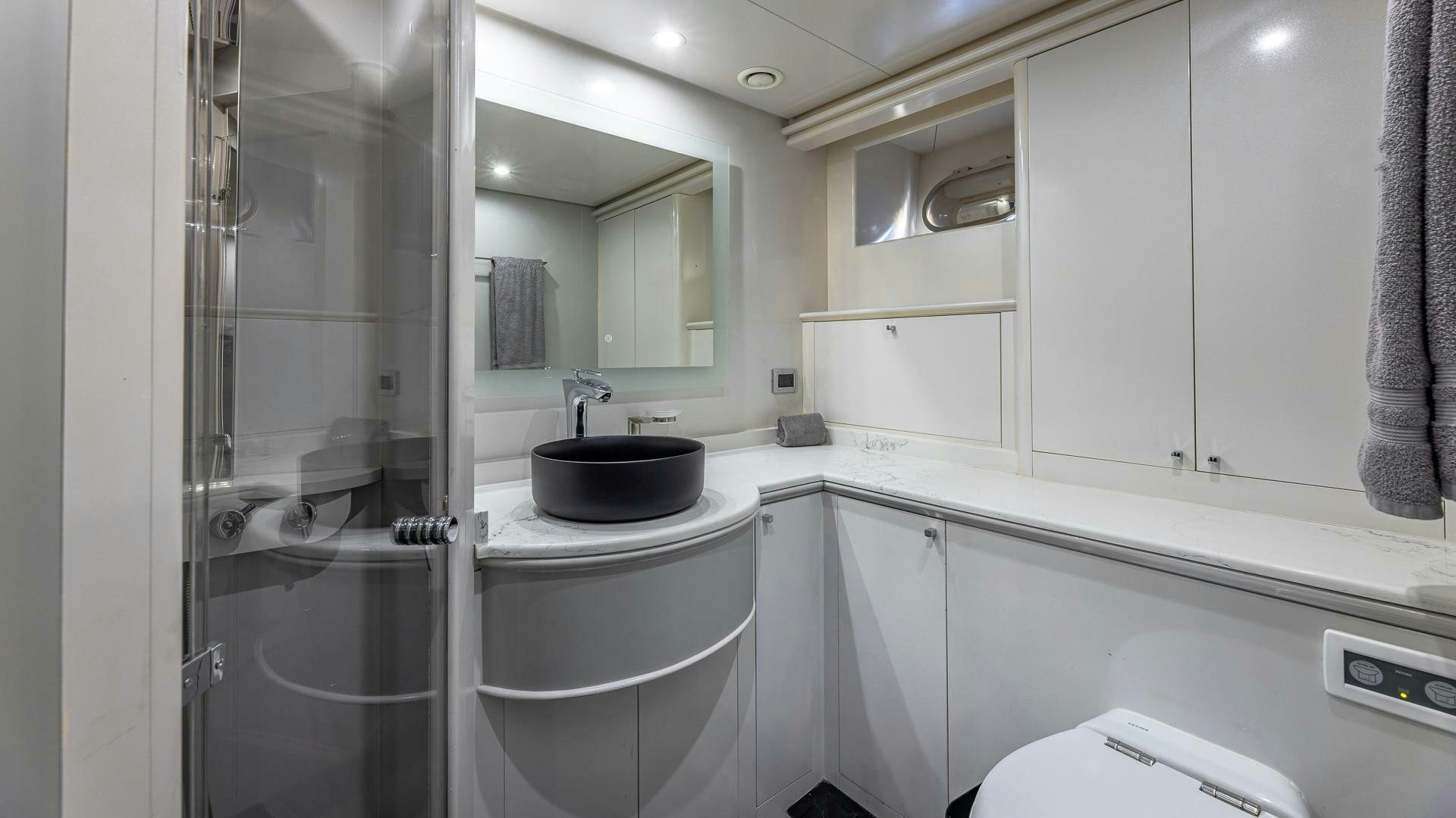 a bathroom with a sink and a mirror aboard 100 AZIMUT JUMBO Yacht for Sale
