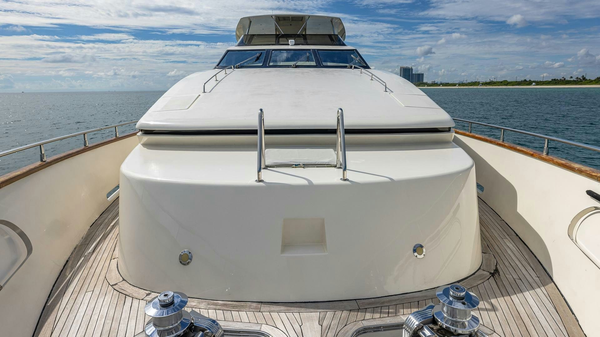 a white boat on a deck aboard 100 AZIMUT JUMBO Yacht for Sale