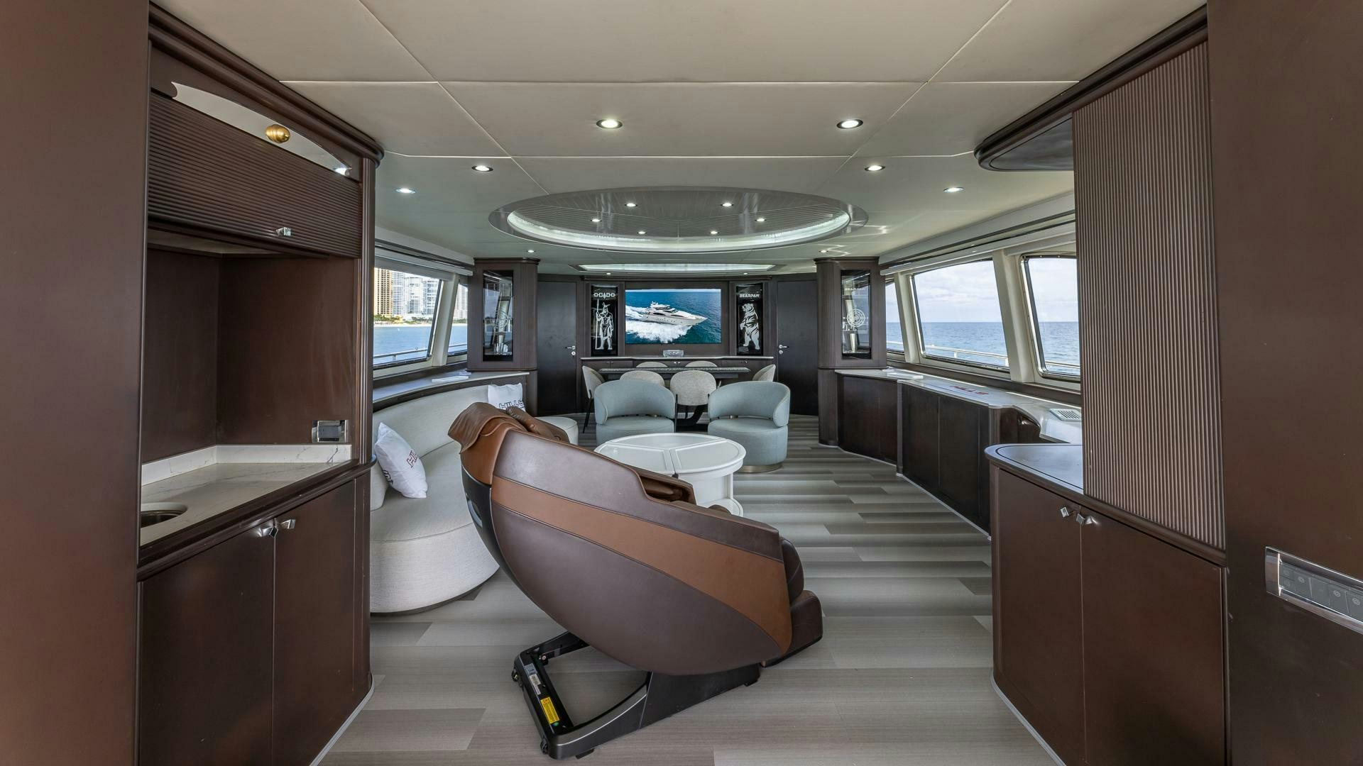 a room with a bed and a desk aboard 100 AZIMUT JUMBO Yacht for Sale