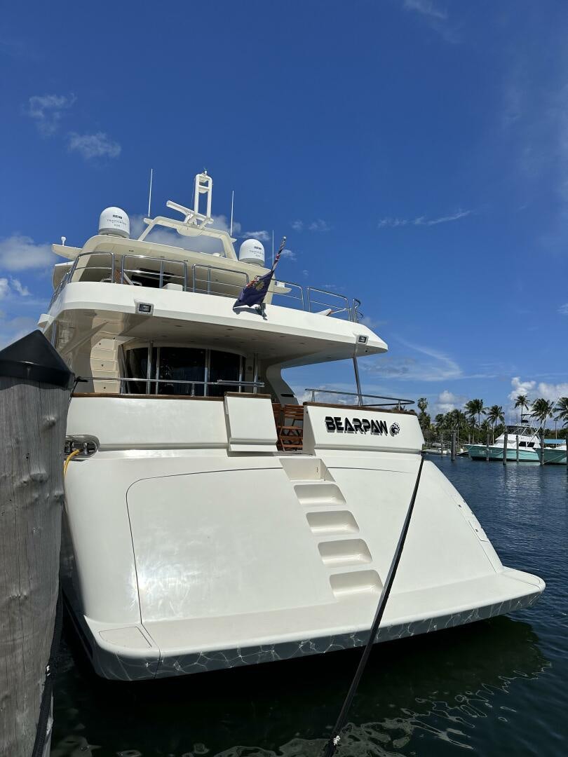 a white boat docked aboard 100 AZIMUT JUMBO Yacht for Sale