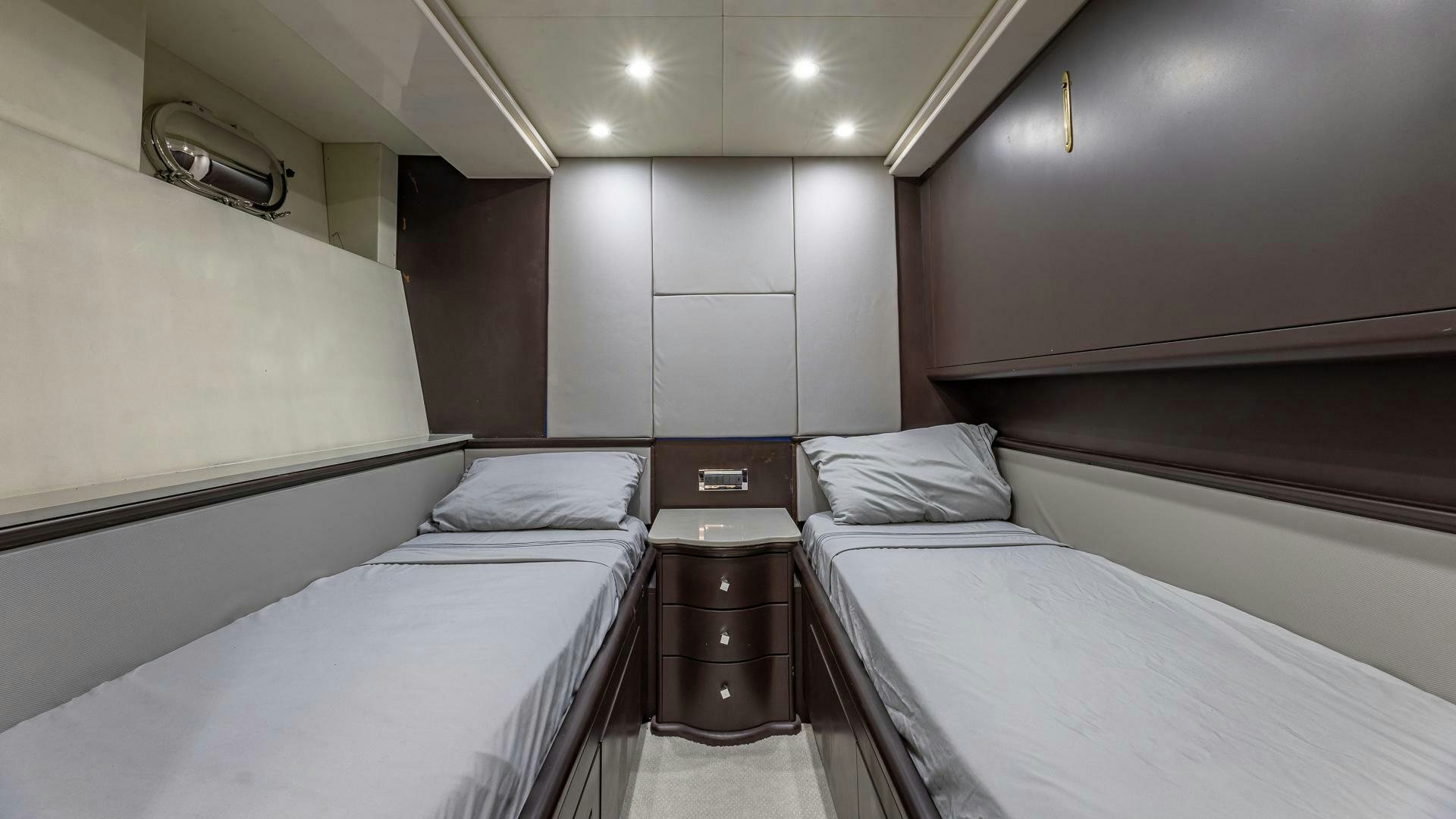 a room with two beds aboard 100 AZIMUT JUMBO Yacht for Sale